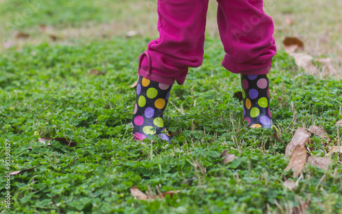 Rainboots in the wet grass on a rainy day