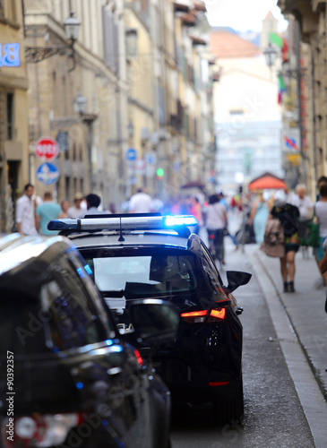 Fotografi italian police car with lights and siren in the city
