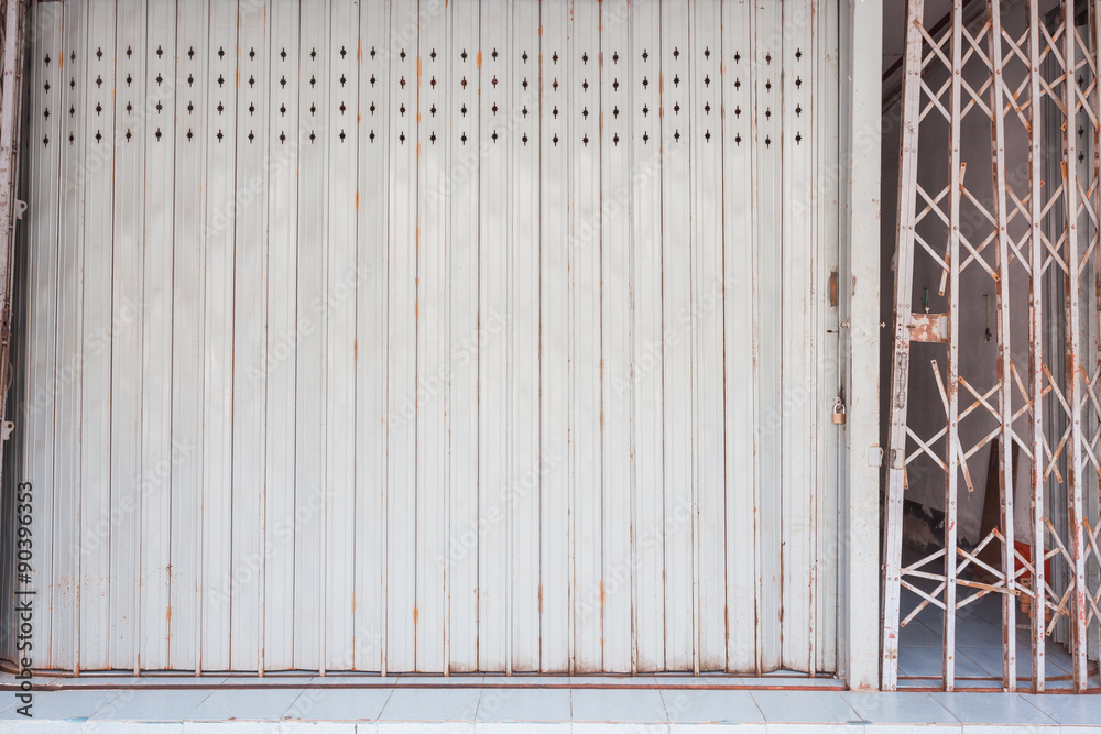 Folding gray old metal door gate