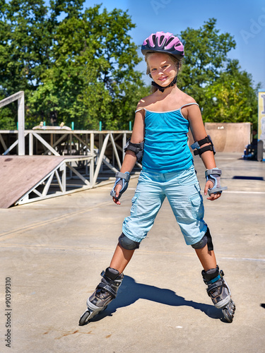 Girl riding on roller skates .