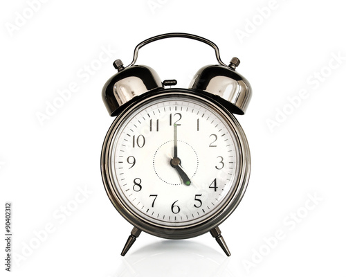 Five on an old vintage alarm clock isolated on white background