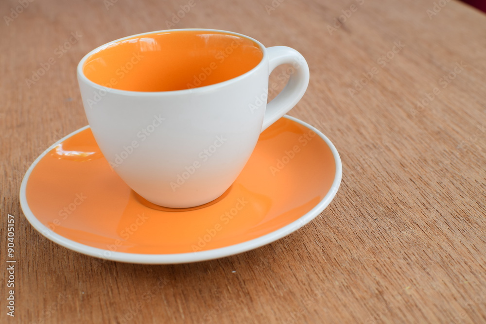 Empty coffee or tea cup on wood board, selective focus Empty coffee or tea cup on wood board, selective focus