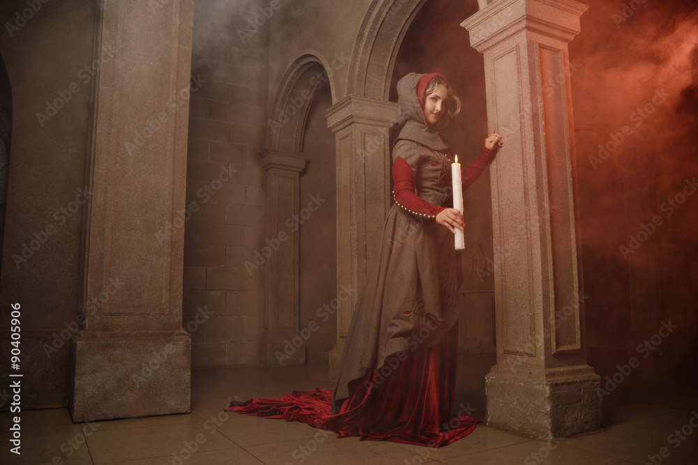 Young woman at medieval castle