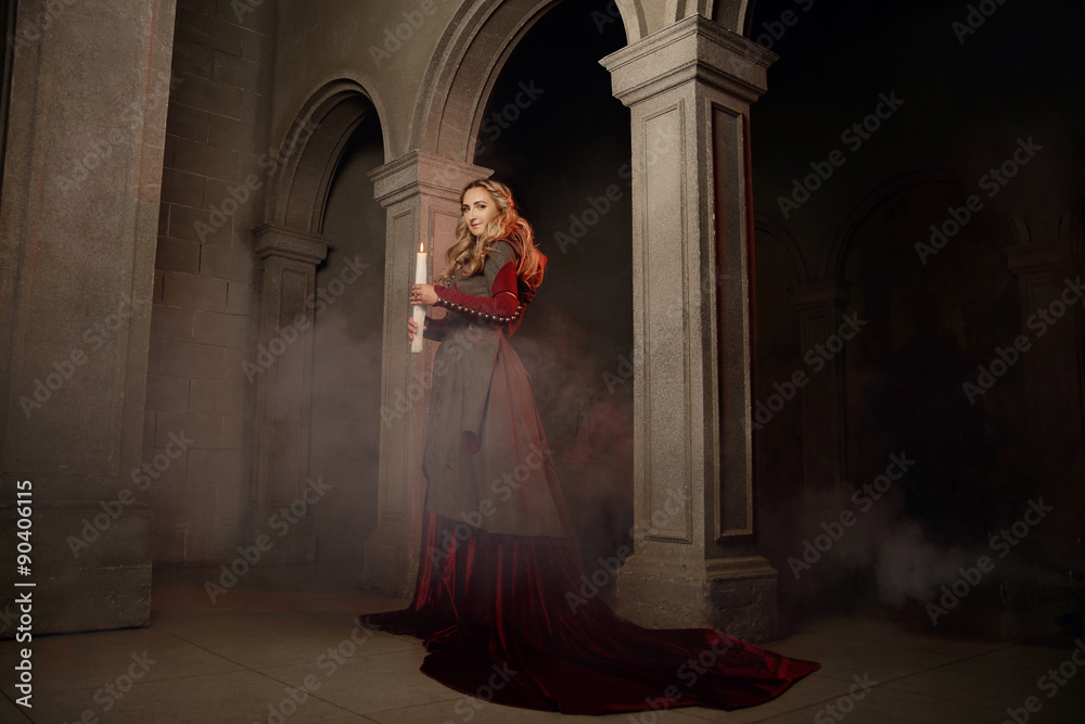 Young woman at medieval castle