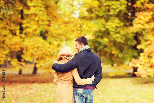 smiling couple hugging in autumn park from back © Syda Productions