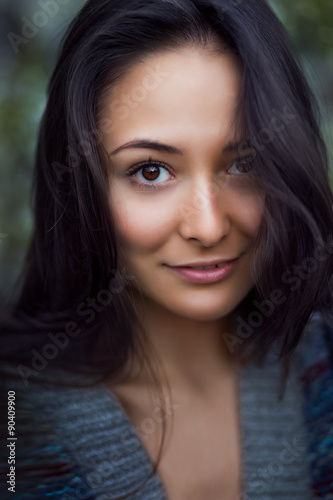portrait of pretty young woman smiling closeup © muzhchil