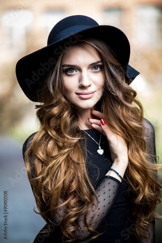 beautiful stylish young woman (girl) in dress and hat © muzhchil