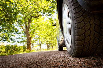Car on asphalt road in summer