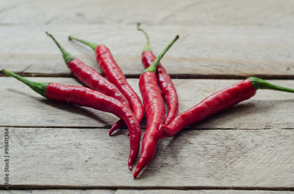 Red chili on an wooden background. Red chili on an wooden background.