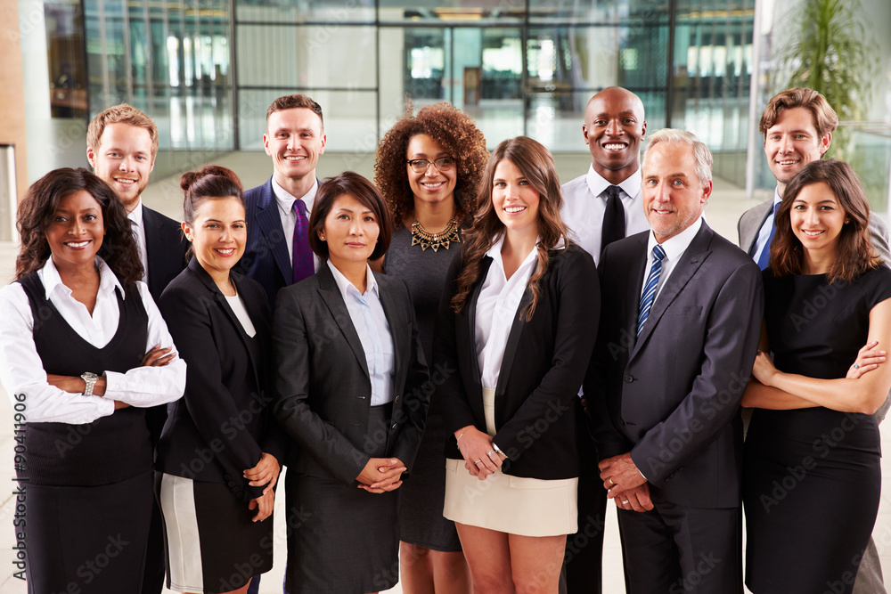 Smiling group portrait of corporate business colleagues Smiling group portrait of corporate business colleagues