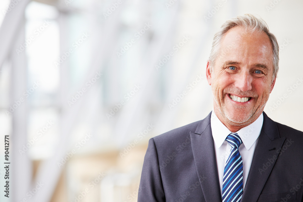 Head and shoulders portrait of smiling senior businessman Head and shoulders portrait of smiling senior businessman