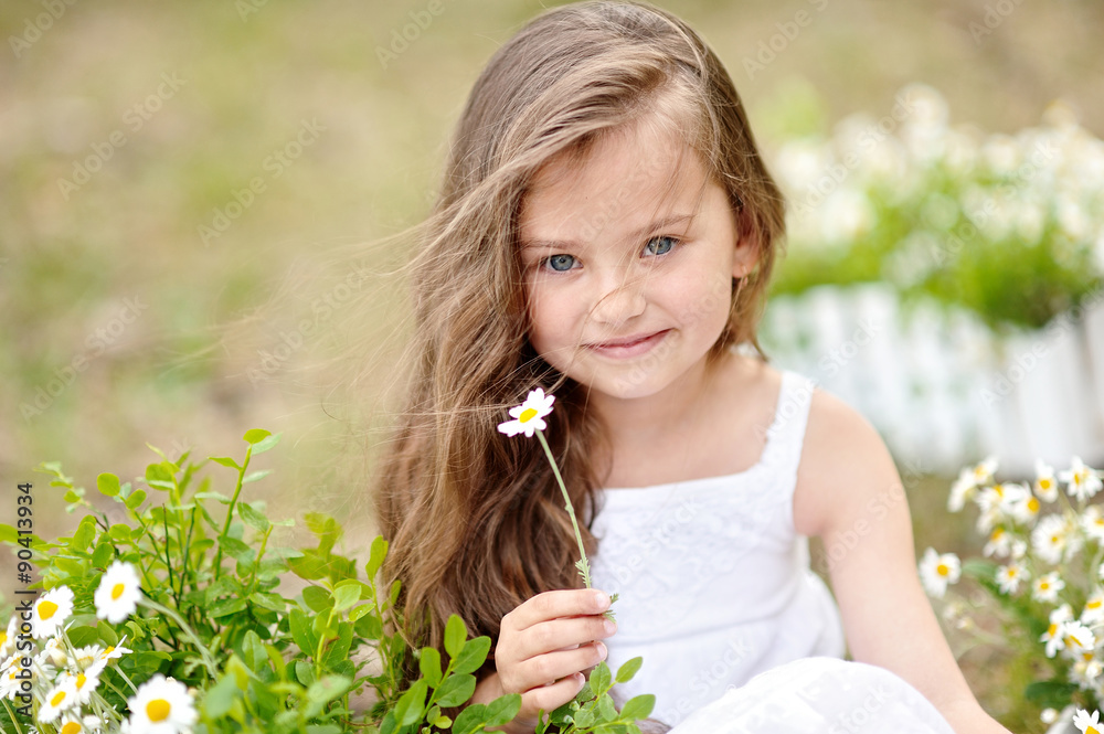 portrait of a beautiful little girl with flowers portrait of a beautiful little girl with flowers