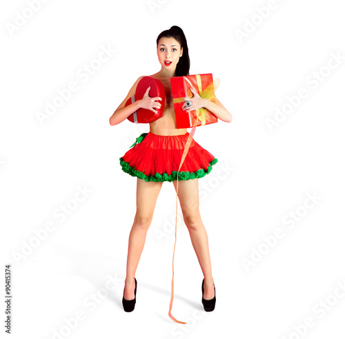 Naked smiling young girl is covered with gifts boxes in