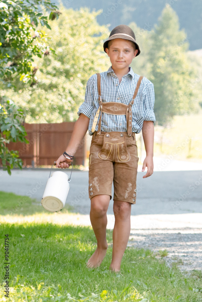 Junge in Lederhose mit Milchkanne Stock Photo | Adobe Stock
