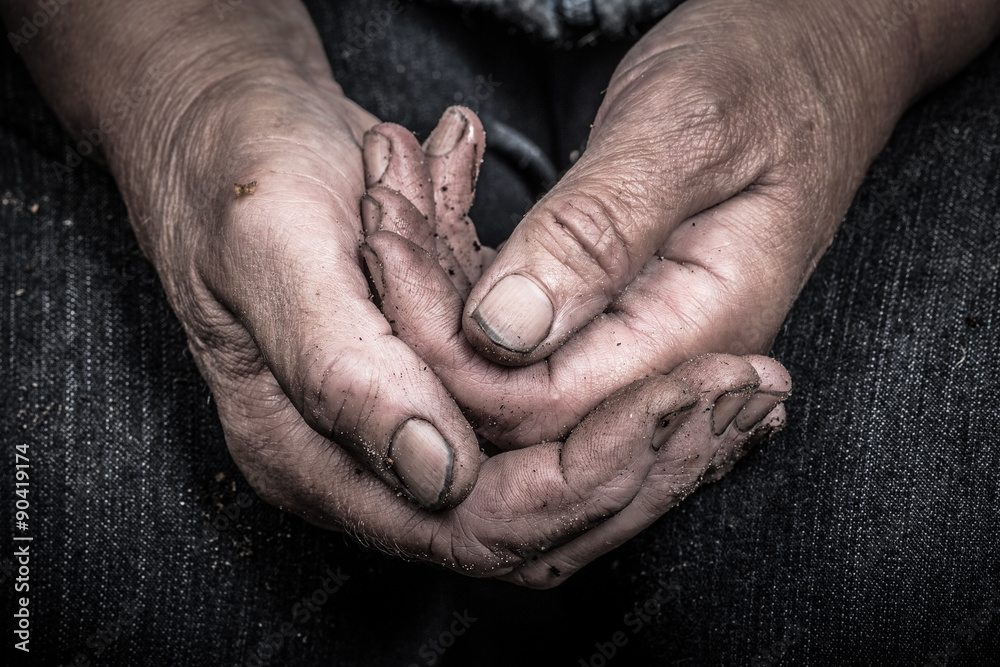 Fototapeta premium Soiled hands of elderly women