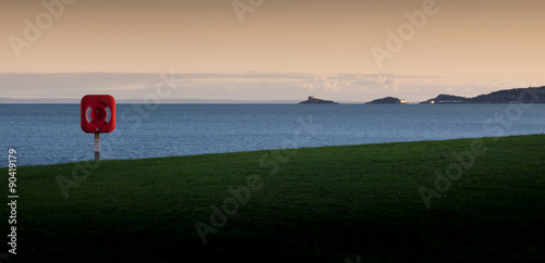 Swansea bay with a life saver and view of The Mumbles