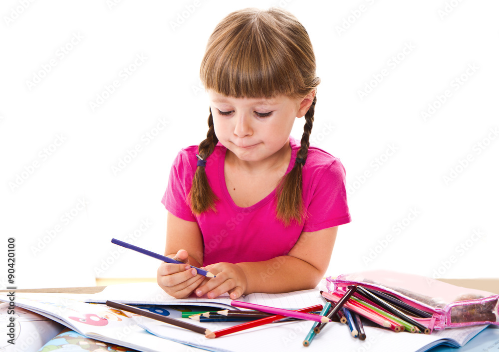 lovely little girl writing at the desk lovely little girl writing at the desk