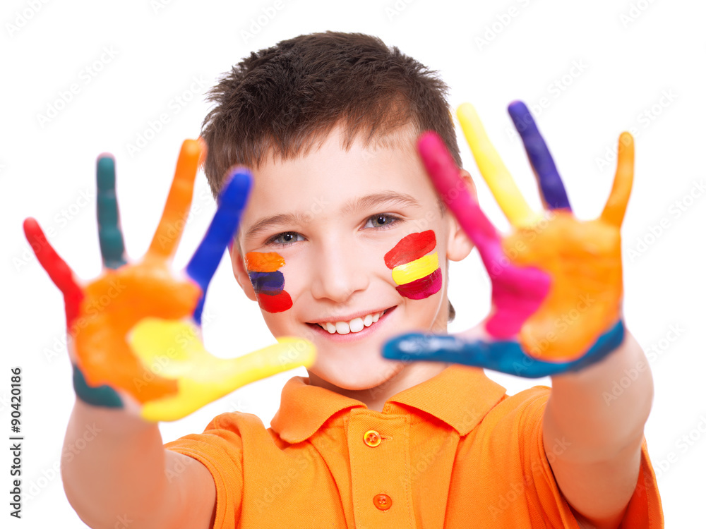 Happy smiling boy with a painted hands and face. Happy smiling boy with a painted hands and face.