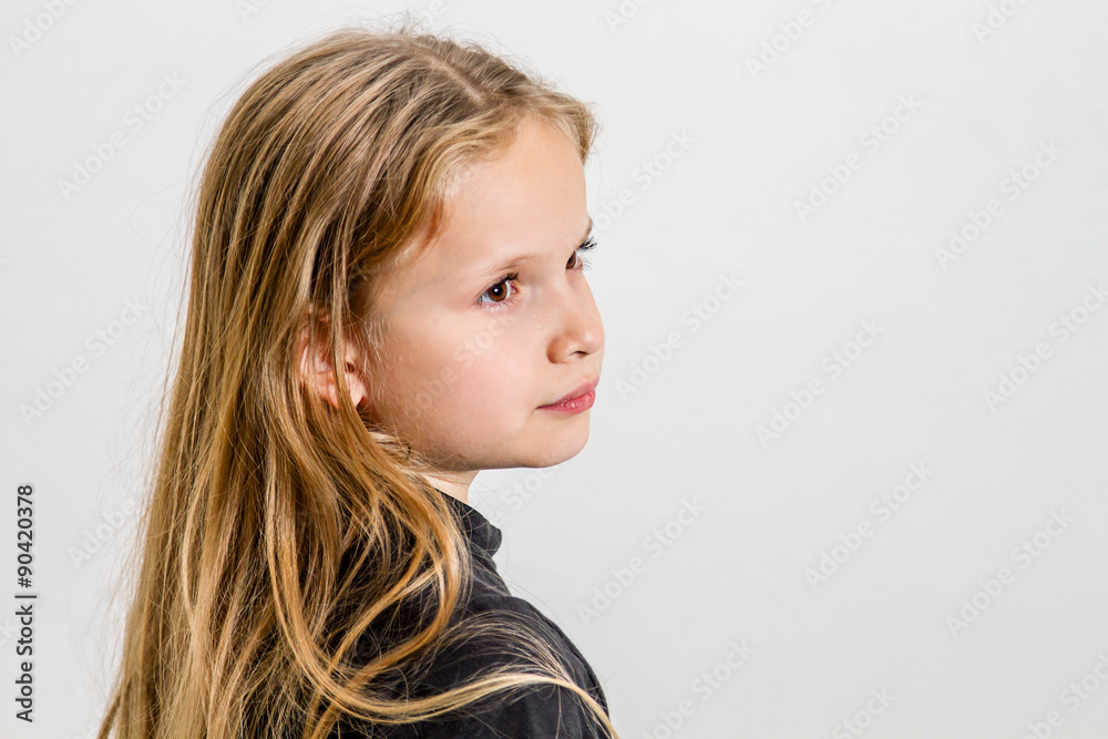 Portrait of a teenage girl with long blond hair and brown eyes Portrait of a teenage girl with long blond hair and brown eyes