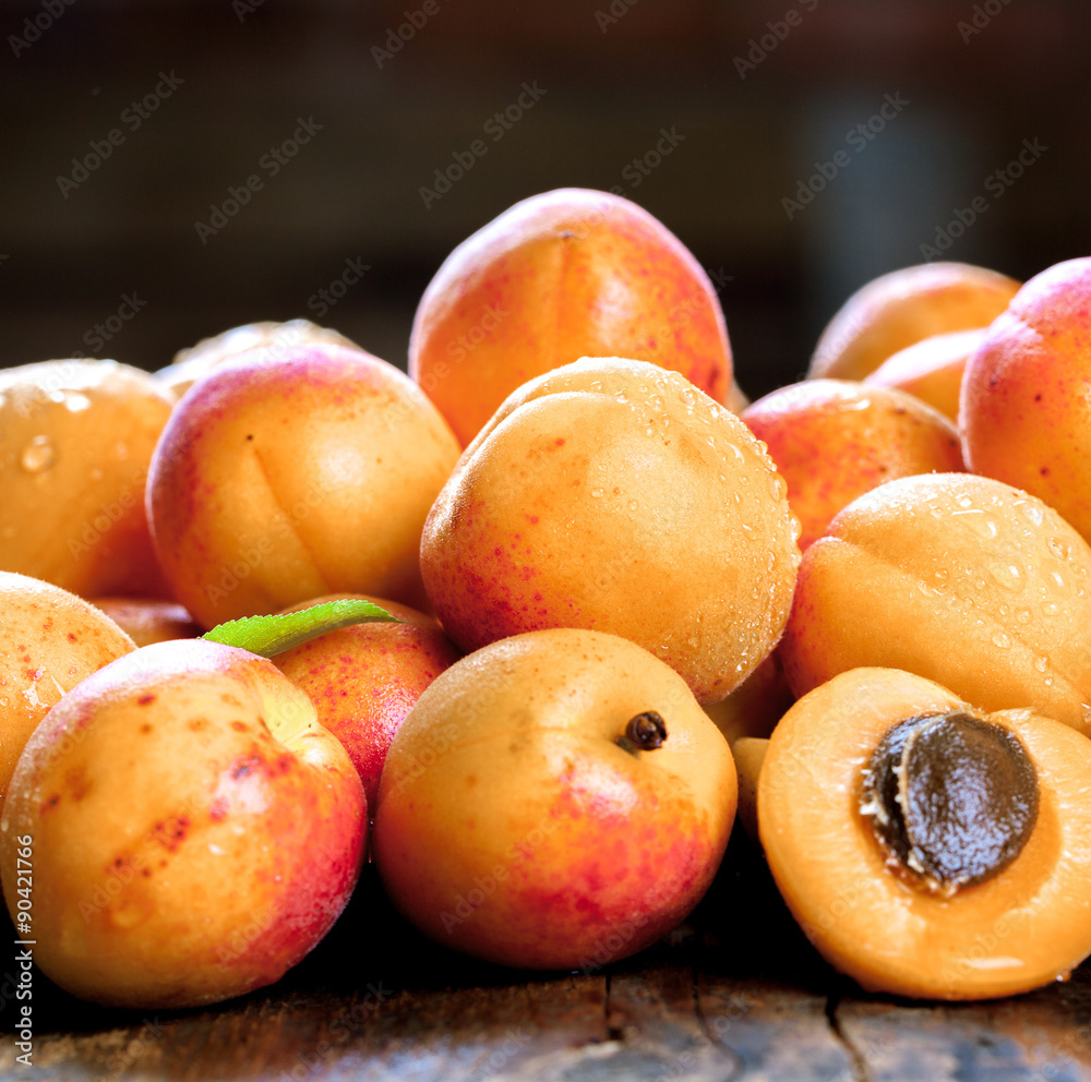Apricot. Organic fruits with leaf on wooden background Apricot. Organic fruits with leaf on wooden background