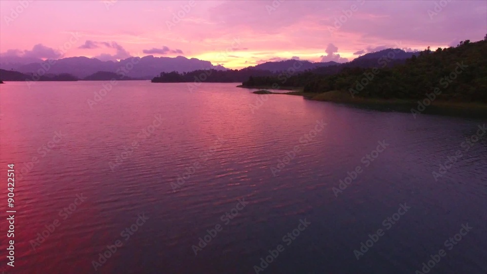 vivid purple lake sunset, aerial shot