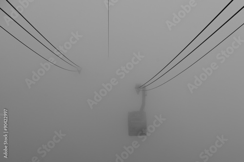 Cable car coming out from the mist.