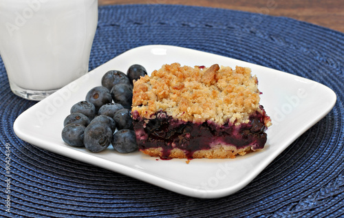 Blueberry bar cookie and milk. photo