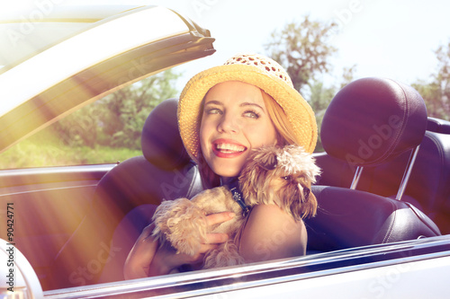 Happy girl with cut dog in ...