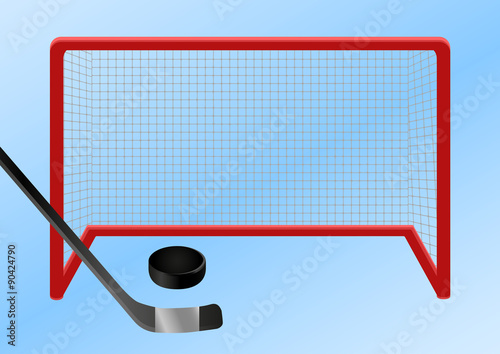 Ice hockey - goal. The puck is shot along the ice into the ice hockey goal.