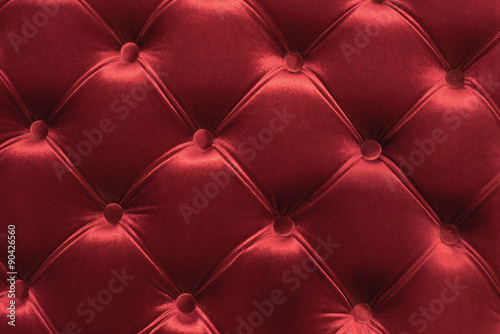 red textile upholstery pattern with buttons
