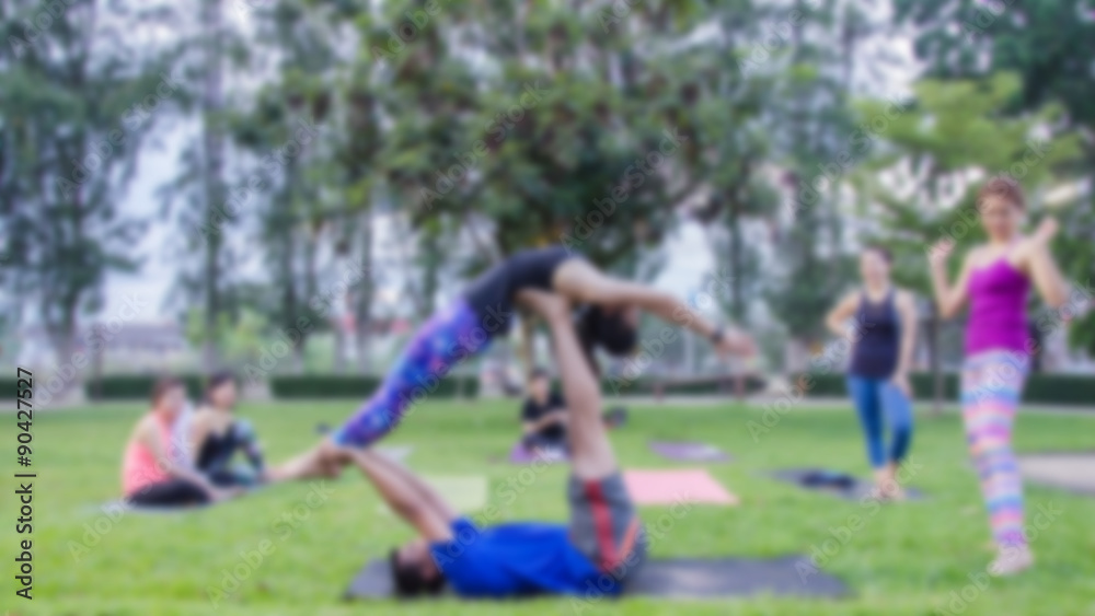 blurred woman fitness group - yoga team.