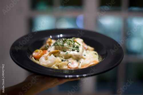 Photography creamy seafood, scallop and fish Fettuccine alfredo pasta dish