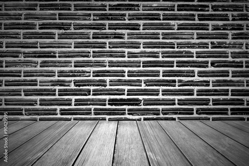 Dark room wood floor and brick wall background © jcsmilly