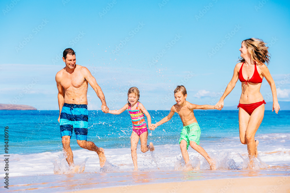 Happy Family Having Fun on the Beach