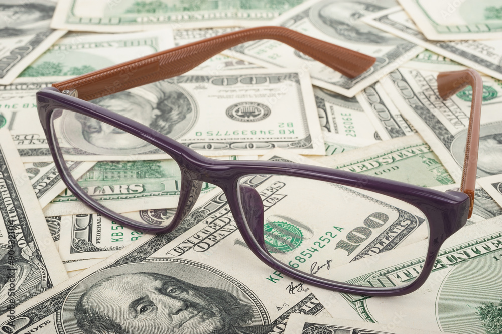 Glasses and dollars