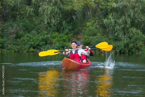 The couple goes kayaking on the river. © trek6500