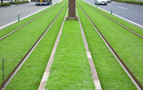 Tramway tracks on green lawn