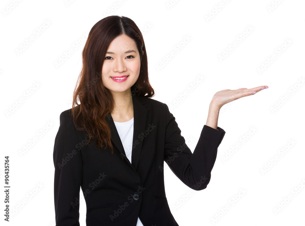 Young businesswoman with hand showing blank sign Young businesswoman with hand showing blank sign