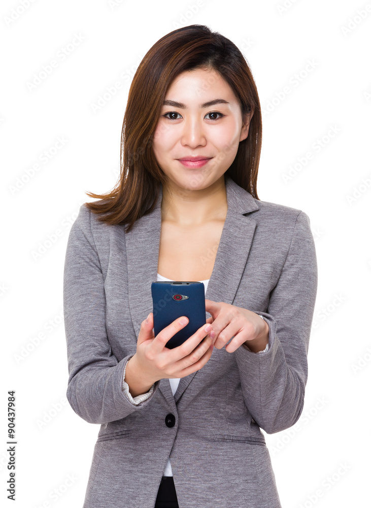 Fototapeta premium Young businesswoman use of the mobile phone