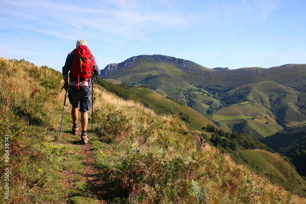 Hiker on a journey in Basque country mountains