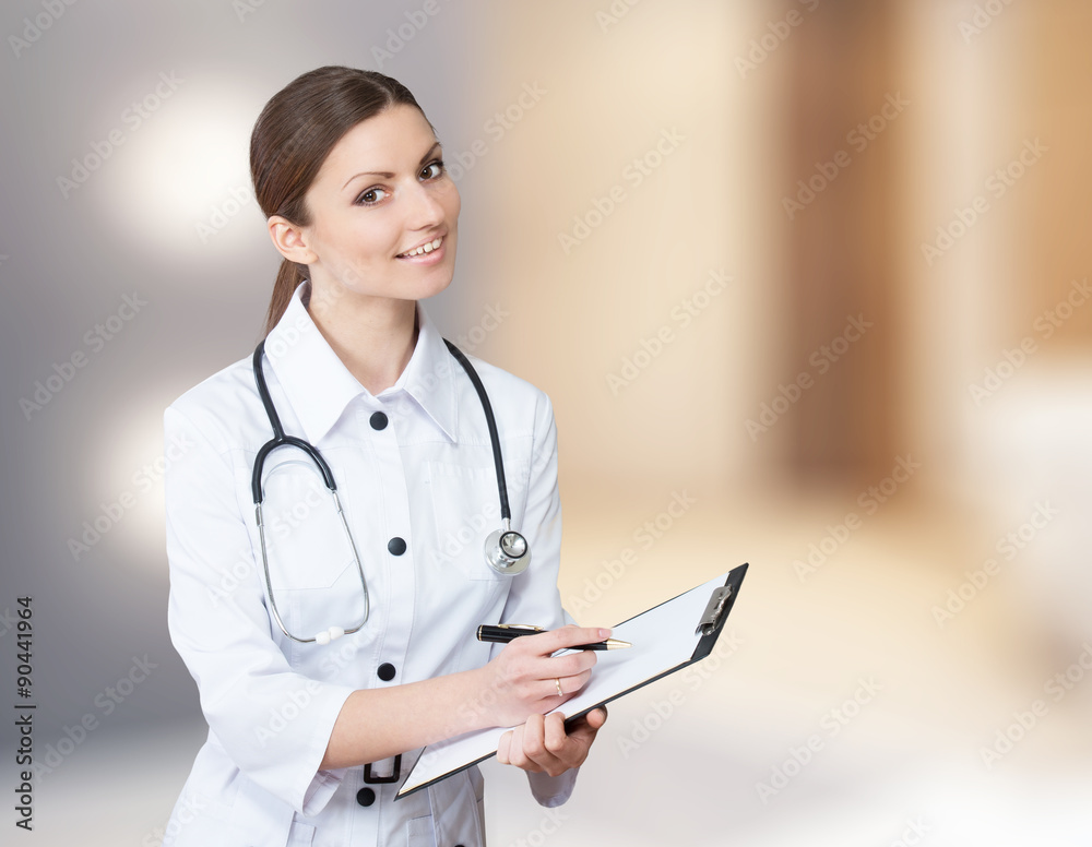 Portrait of a smiling nurse with a clipboard Portrait of a smiling nurse with a clipboard