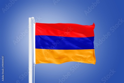 Flag of Armenia flying against a blue sky Free Download Flag of Armenia flying against a blue sky - GFXLoad