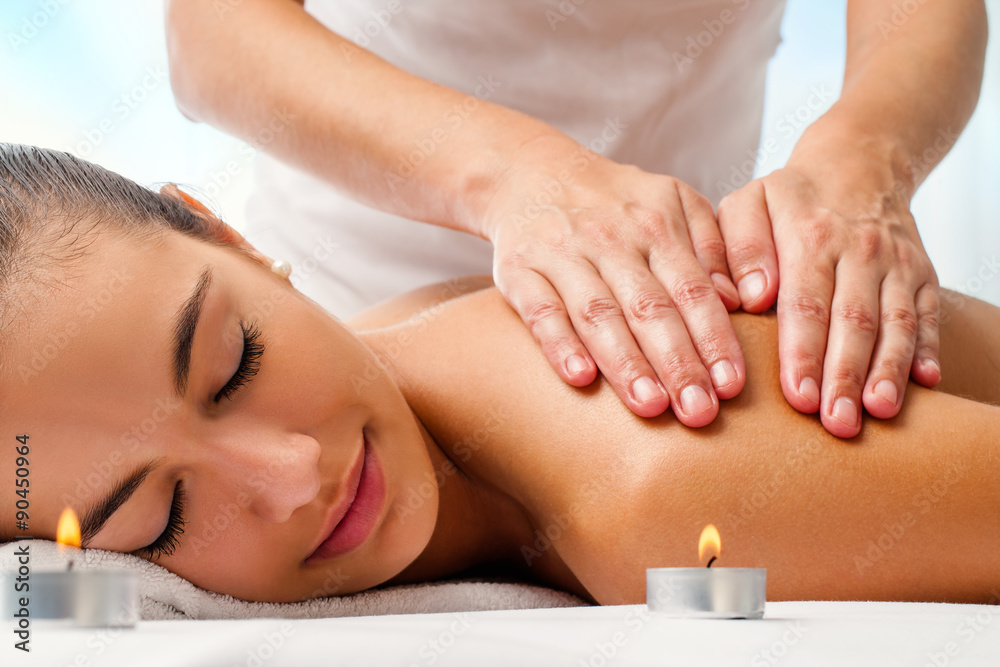 Attractive woman enjoying relaxing massage. Attractive woman enjoying relaxing massage.