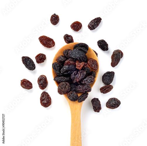 Dried raisins on white background.