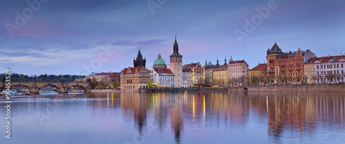 Prague Panorama. Panoramic image of Prague riverside and Charles Bridge, with reflection of the city in Vltava River.