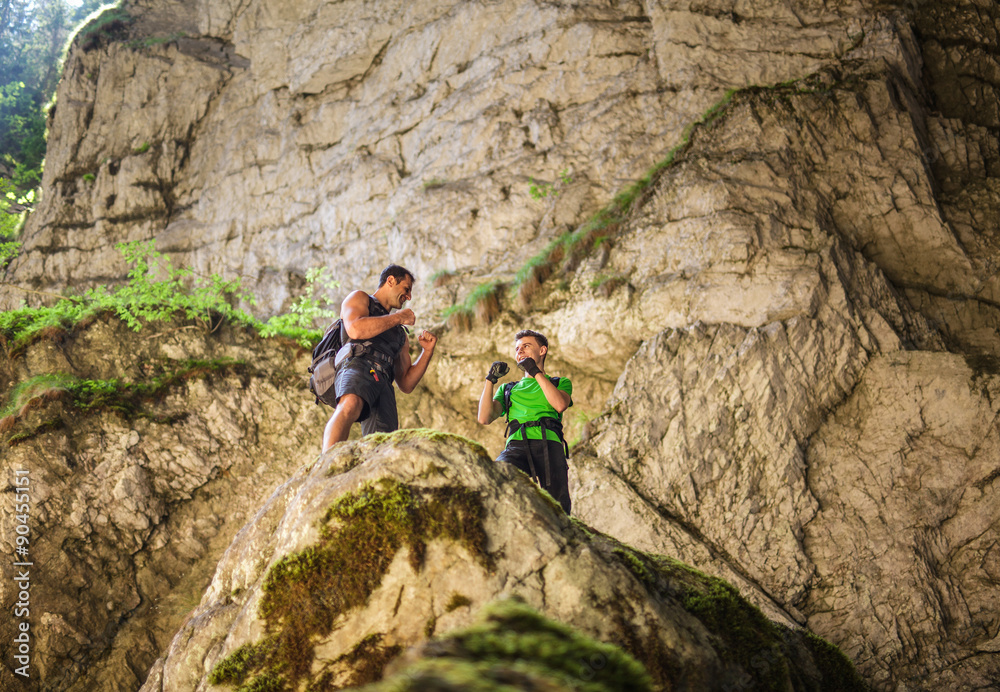 Hikers boxing on a mountain cliff