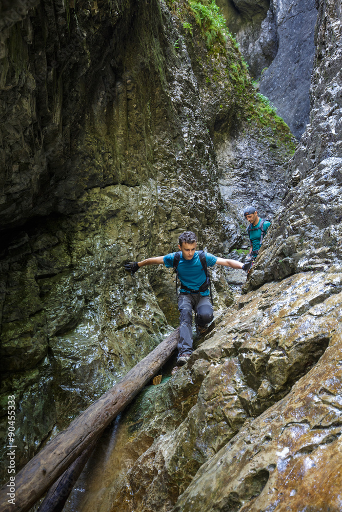 Two men hiker walking in a canyon Two men hiker walking in a canyon