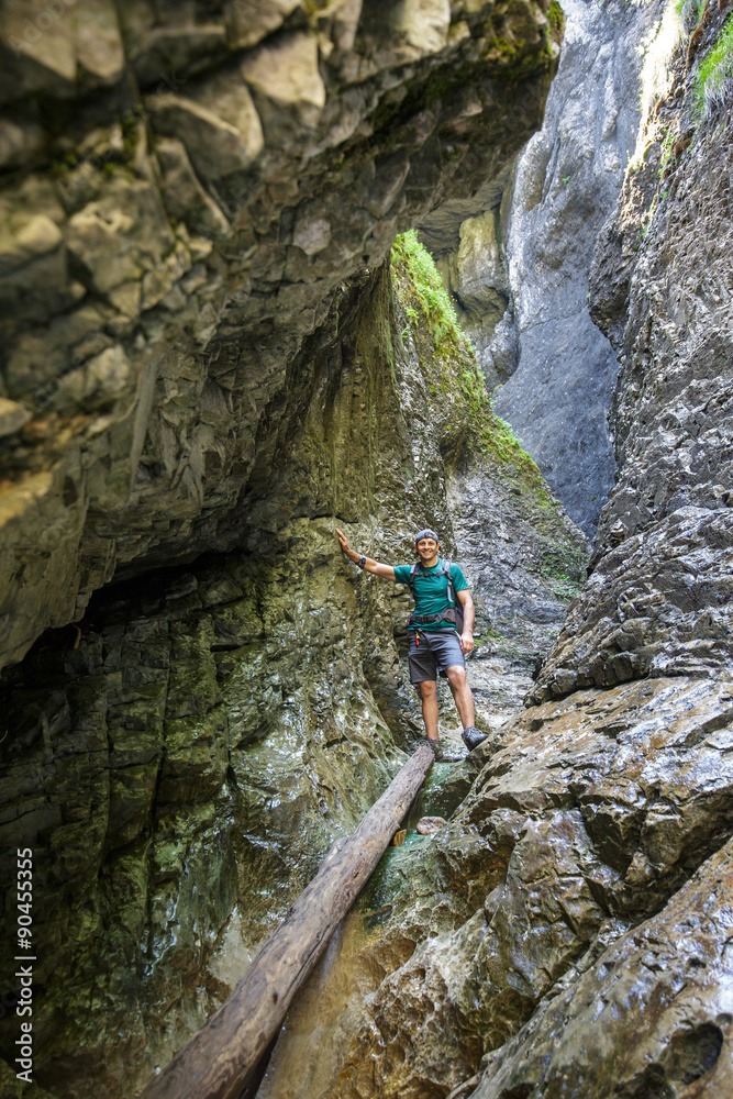 Man hiker walking in a canyon