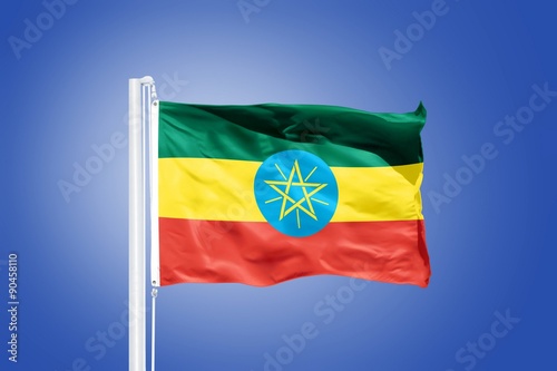 Flag of Ethiopia flying against a blue sky