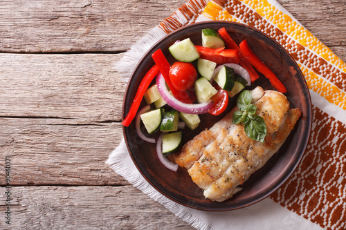 Canvas Print Grilled white fish and fresh vegetable salad